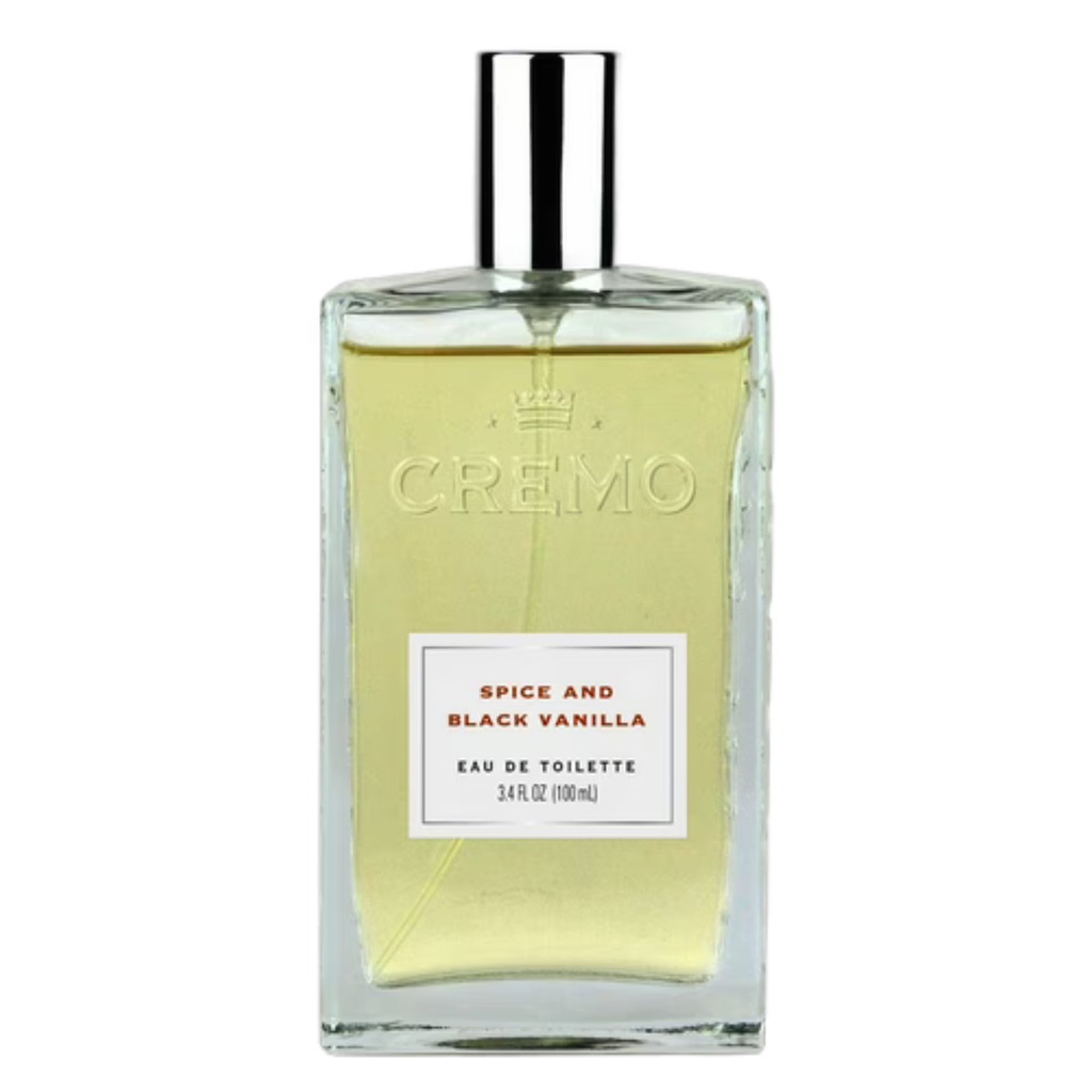 Cremo Spice and Black Vanilla perfume sample bottle with black and orange packaging, showcasing the fragrance design.