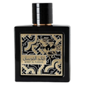 Sample of Lattafa Qaed Al Fursan perfume bottle with intricate gold and black design, displayed on a neutral background.
