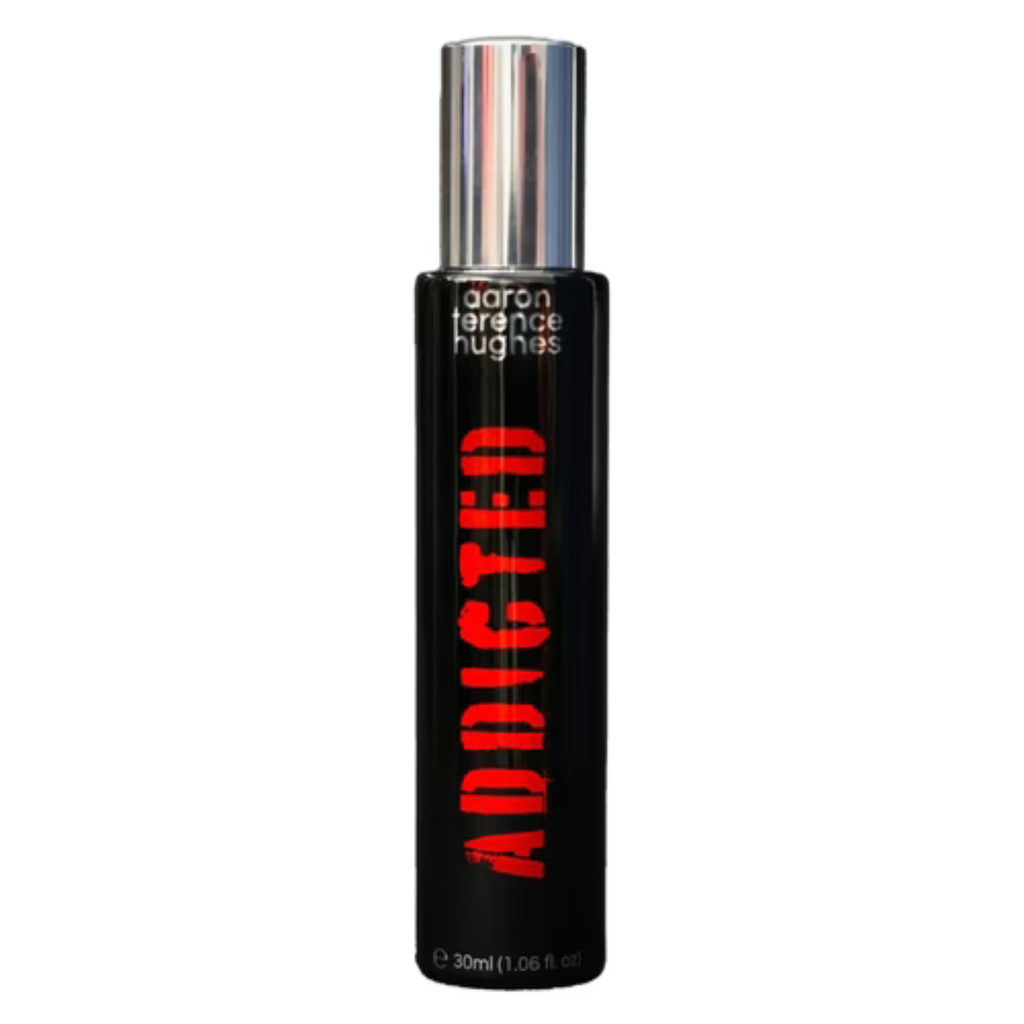 Aaron Terence Hughes Addicted sample in a clear container, showcasing the product's design and branding details.